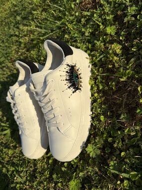 Kurt Geiger White Sneakers with Black Heel and Gold Embellishment